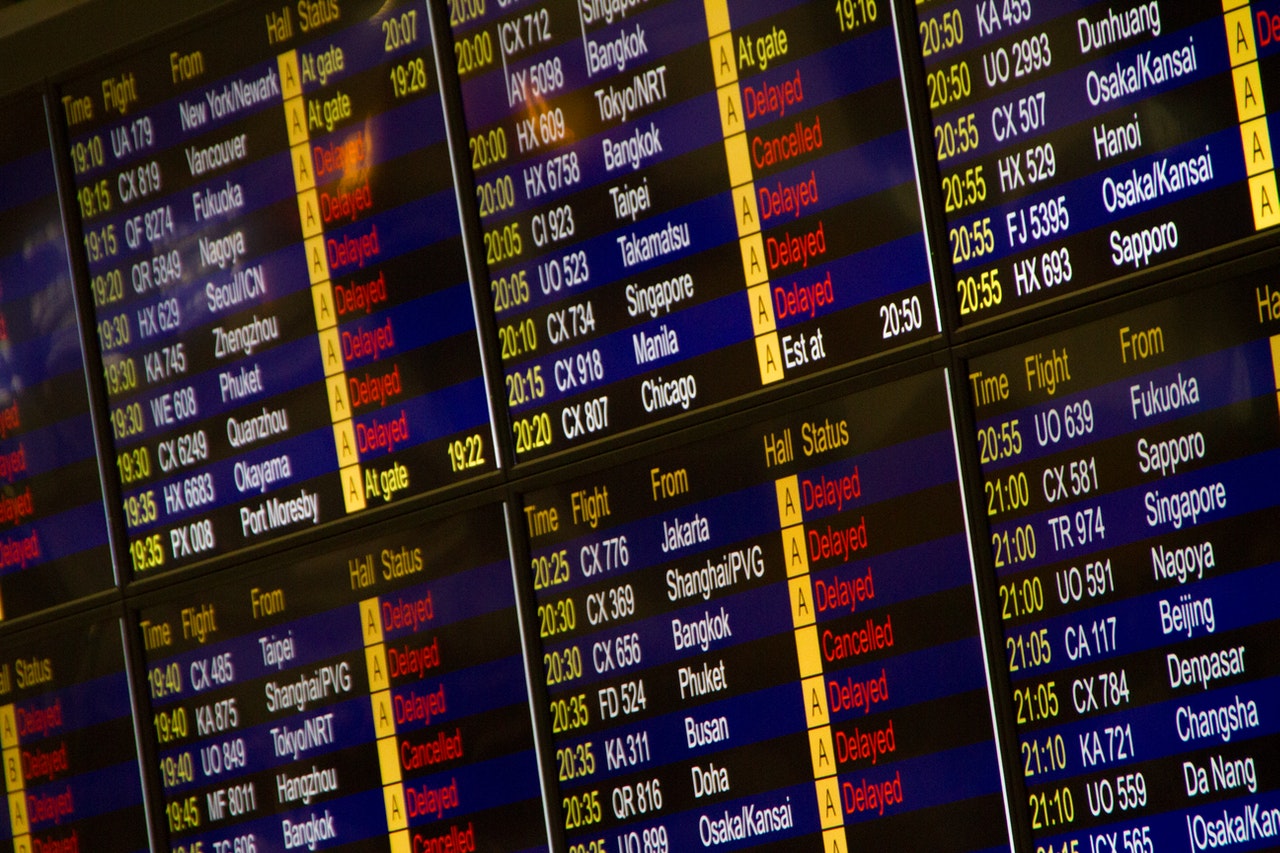 Photo of airport flight status display. Photo by LT Chan: https://www.pexels.com/photo/flight-schedule-screen-turned-on-2833379/